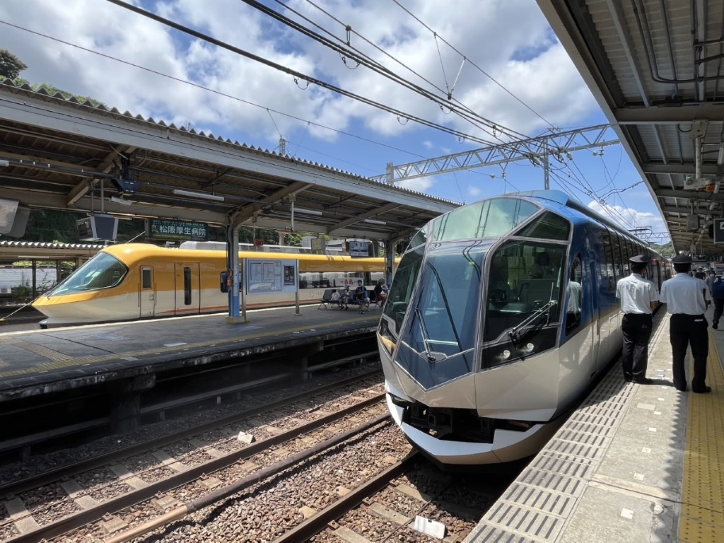 Kintetsu Railway limited express trains stopped at a station platform in Japan
