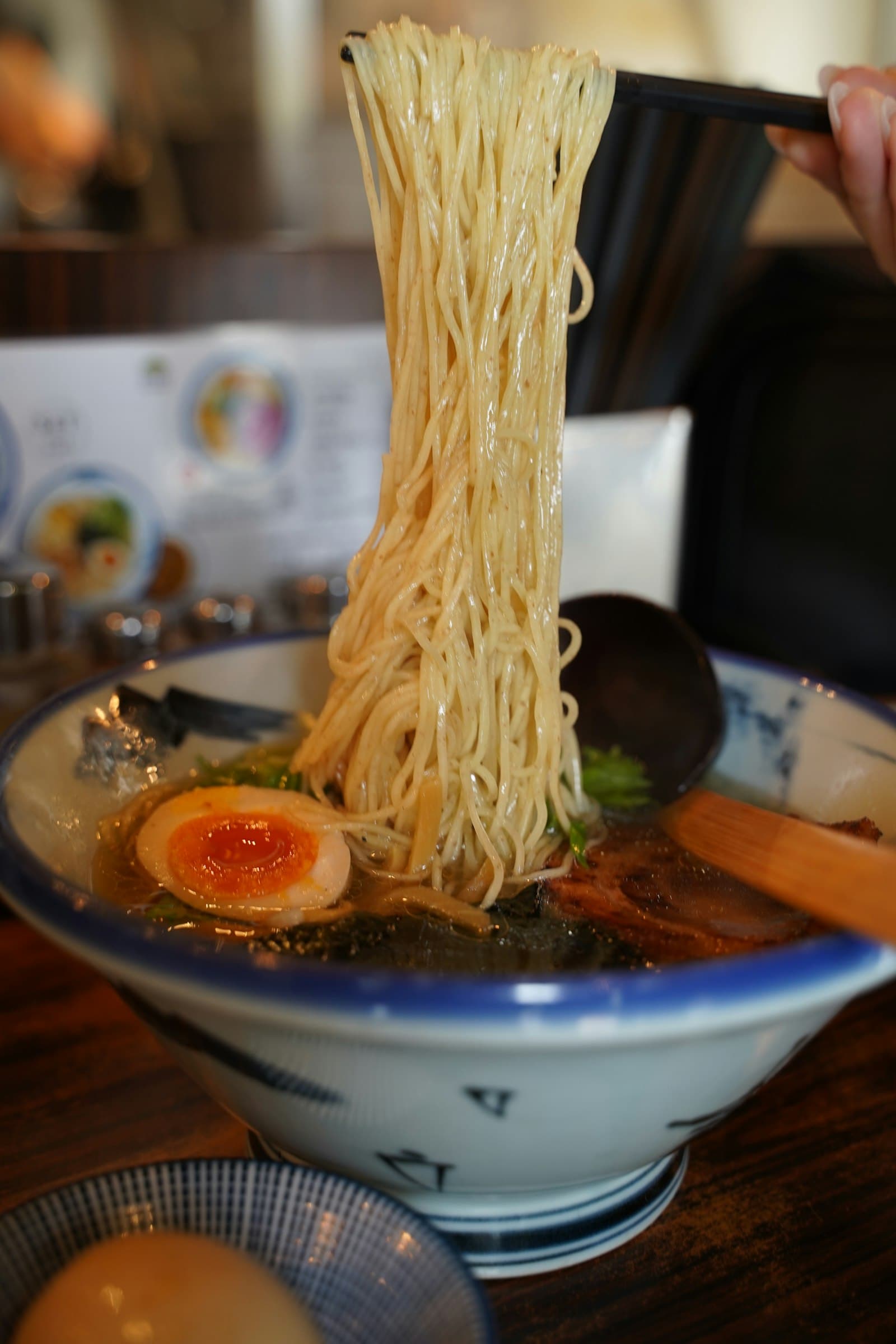 Bowl of ramen with chopsticks and egg in Tokyo
